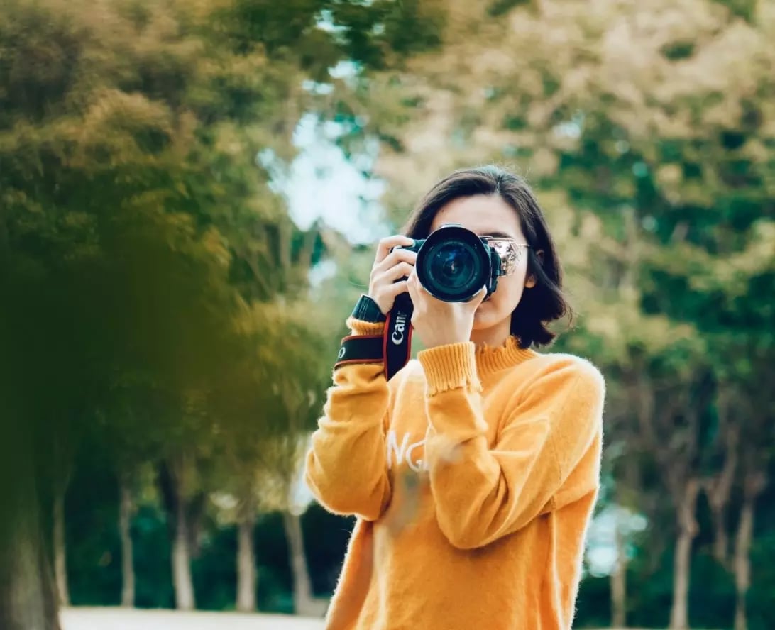 Young creative capturing photos during a graphic design internship in Ireland