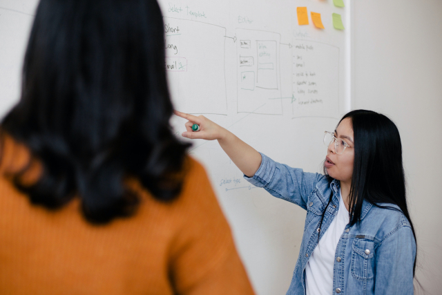 two women talking about impact investment