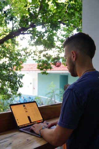 Digital nomad working remotely (by Jordan Carroll on Unsplash).