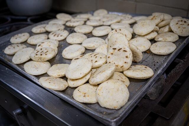 Mini arepas on a stove in Medellin, Colombia