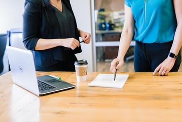 A manager uses their leadership skills to talk to a team member.