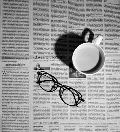 Reading a newspaper during a journalism and media internship in Australia.