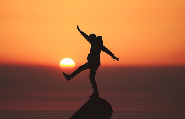 Celebrating success while hiking for mental wellbeing at work.