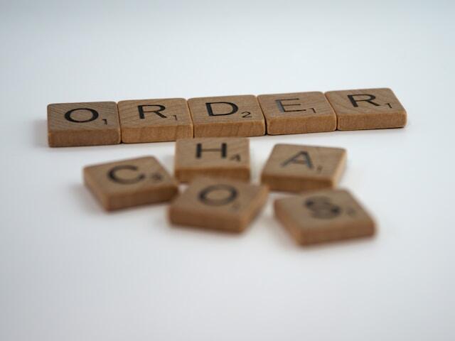Scrabble tiles that read 'order' and 'chaos'