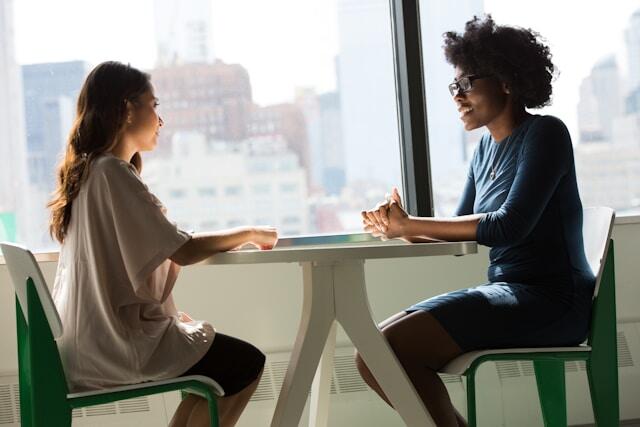A young professional chats about their international work experience in a job interview.