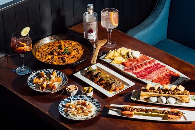 A table laid out with Spanish tapas dishes.