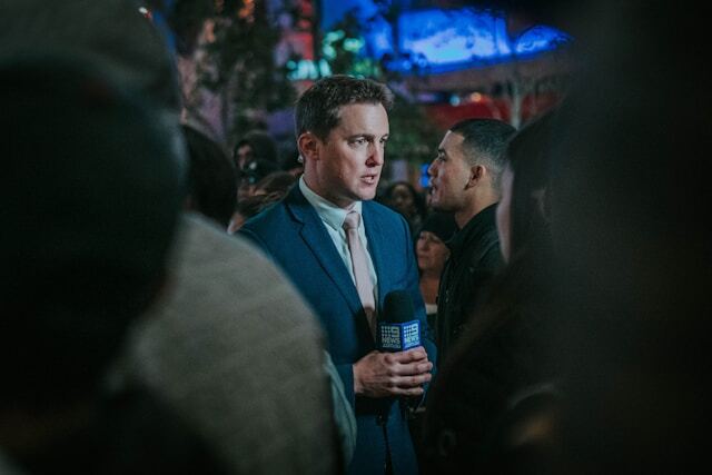 Being part of the media by presenting the news.