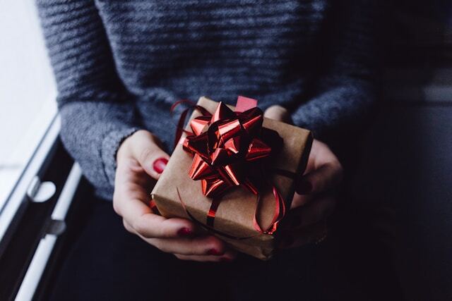Giving Christmas gifts to new friends at an internship abroad.