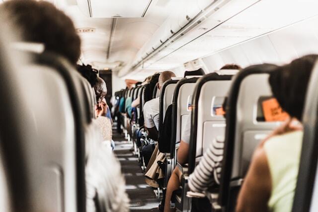 People sitting on a plane waiting to head off to their internship abroad!