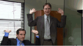 The Office characters doing the raise the roof gesture at their work.