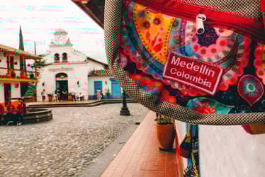 A bag that reads 'Medellin, Colombia' against views in the Colombian city.