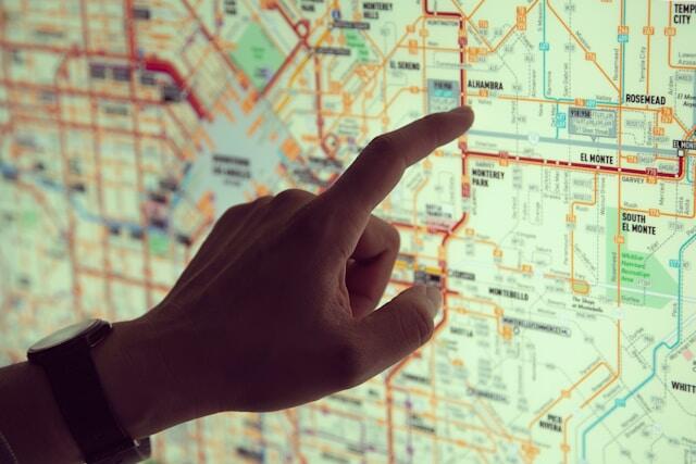 A man navigating a new city looks at a city map.