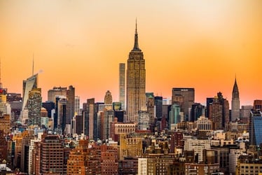 New York skyscrapers during an orange sunset.