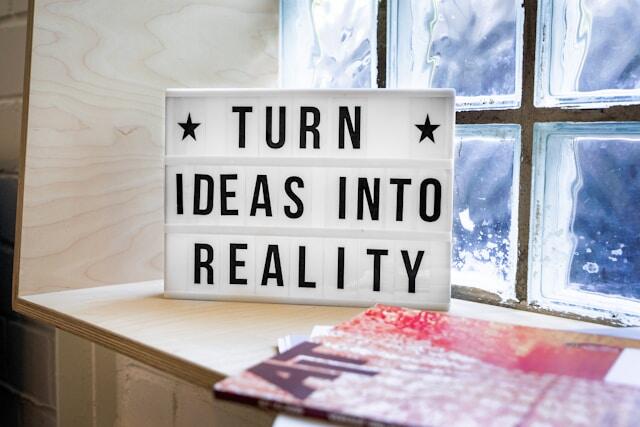A sign that says 'turn ideas into reality.'