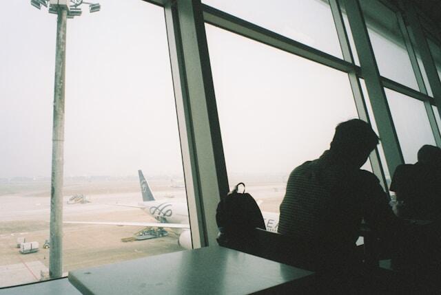 A teenager at an airport ready to go abroad for an international internship with The Intern Group.