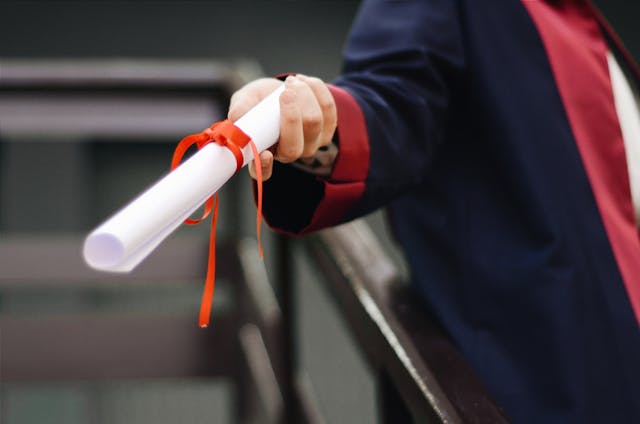 A young professional receiving an internship abroad scholarship.