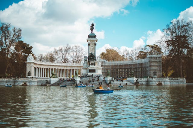 People rowing in Retiro park in Madrid, Spain.