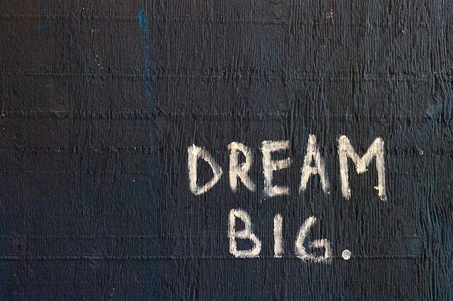 A sign reading 'dream big.'