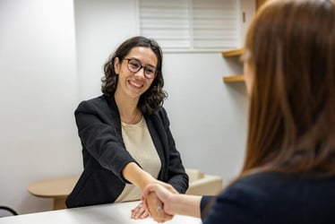 A young professional being hired after a successful interview.