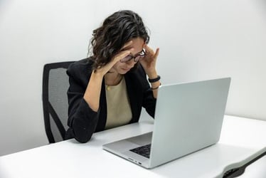 An intern looking stressed after making a mistake at work