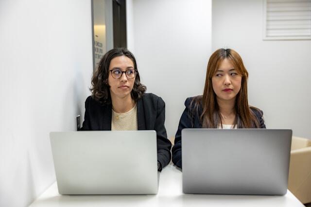 Two coworkers annoyed at each other's bad work habits.