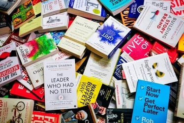 A stack of self-improvement books.