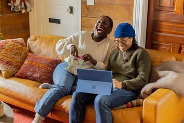 Laughing with co-workers in the workplace during an internship abroad.