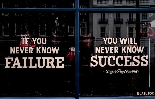 A window display that reads 'If you never know failure, you ill never know success."