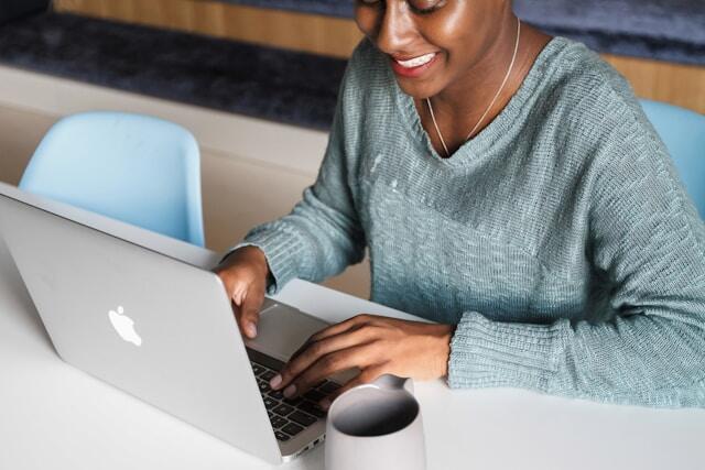 A young professional answering questions at a virtual job interview.