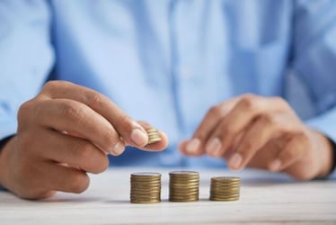 A Gen Z budgeting their money and organizing their cash.