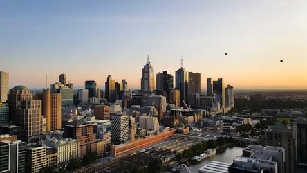 A skyline of Melbourne, Australia at sunset.