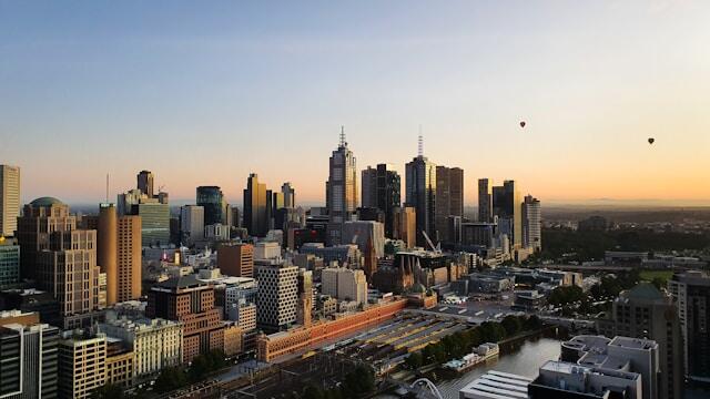 A skyline of Melbourne, Australia at sunset.