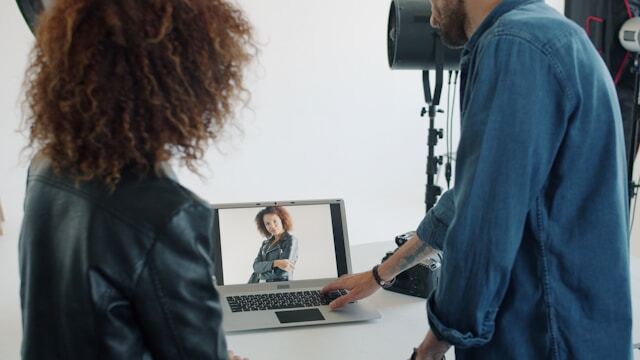 Reviewing a photoshoot during a fashion internship abroad.