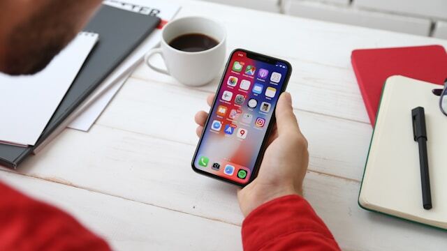 An intern downloading travel apps before going abroad.