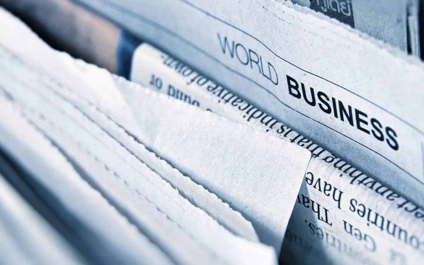 Stack of newspapers from a remote publishing internship