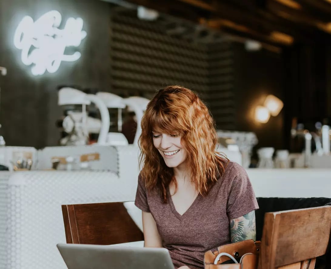 student working in a coffee shop during a remote business internship