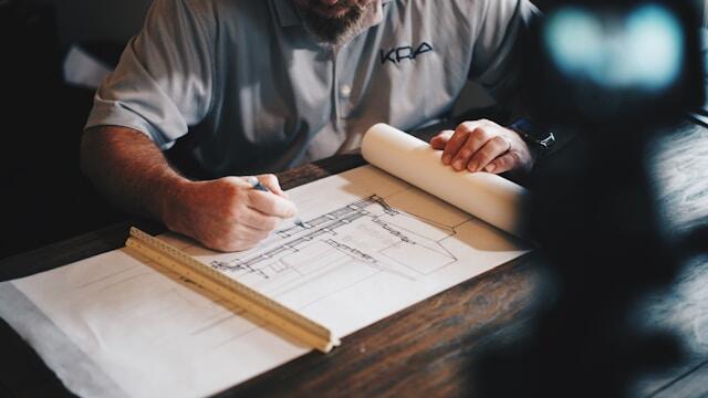 An architect drawing up a blueprint.