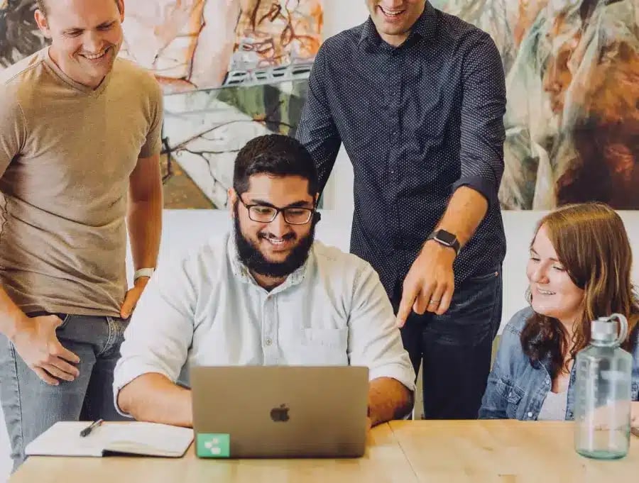 Young professionals socialising at work during a UK marketing internship