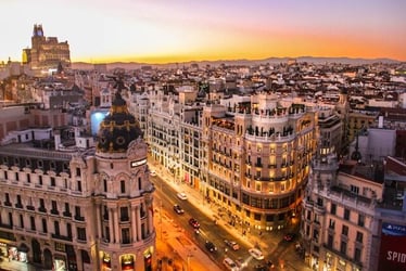 A view of Madrid's skyline at sunset.