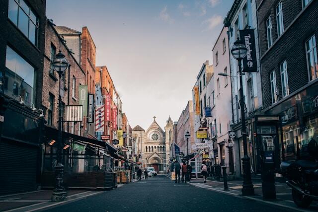 A street in Dublin, Ireland with a cathedral in the background.