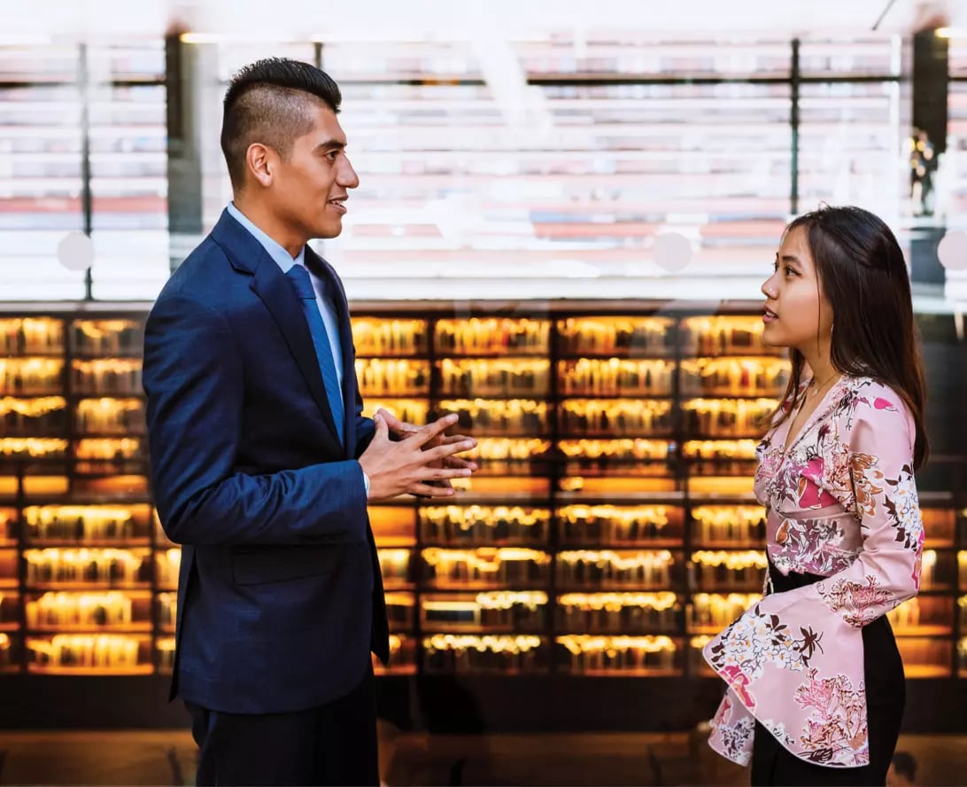 Two co-workers chatting during a social work internship in Madrid