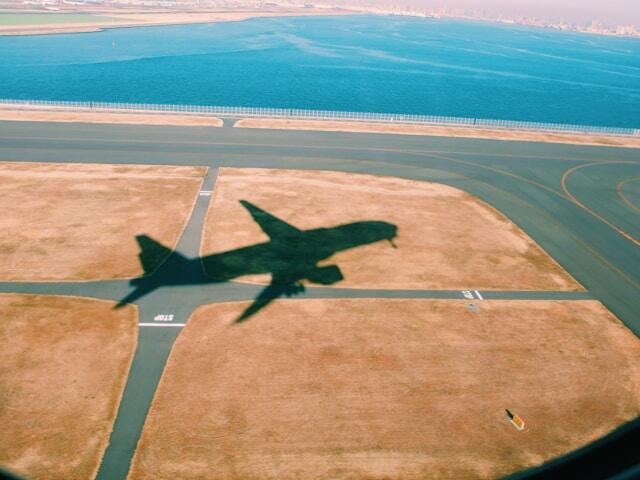 The shadow of a plane taking off in Japan.